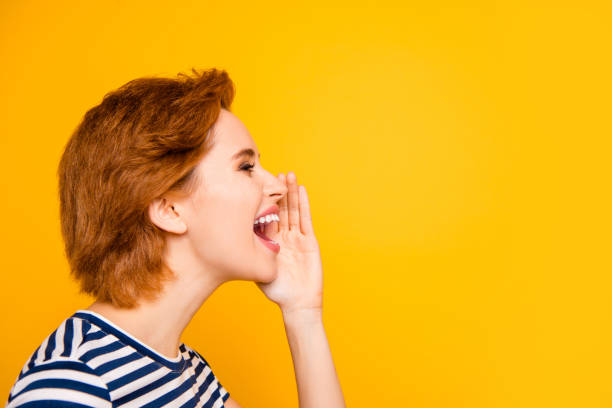 close up side profile photo beautiful amazing she her lady sending sharing spreading rumours people wear casual striped white blue t-shirt outfit clothes isolated yellow bright background - shouting imagens e fotografias de stock