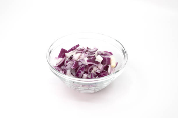 Sliced and diced red onion in a glass bowl