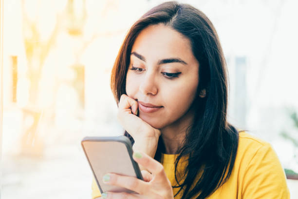 istock Content beautiful young woman using smartphone 1145170562