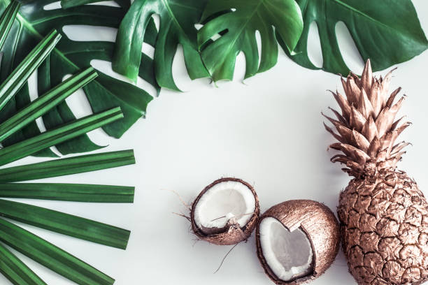 istock summer composition with tropical leaves and fruits on white background 1145173429