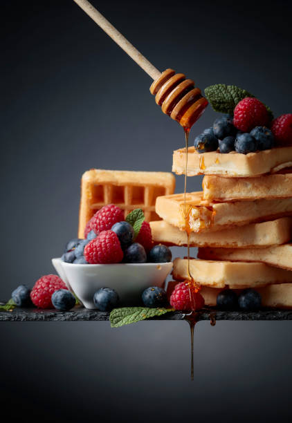 istock Belgian waffles with  blueberries, raspberries  and fresh mint. 1145174666