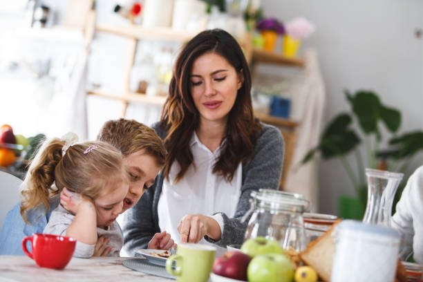 istock Family having breakfast at the dining table 1145175018