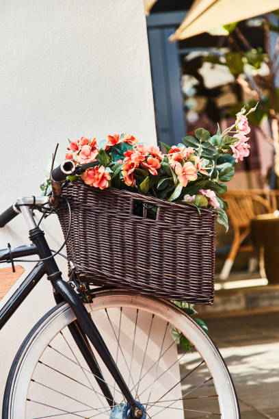istock Vintage bicycle with basket against white wall background. Close-up 1145175150