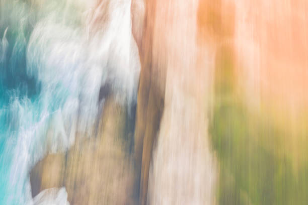 Sea, rocks and landscape, taken from the air.  Motion and blur done in camera for an abstract and creative art-like image