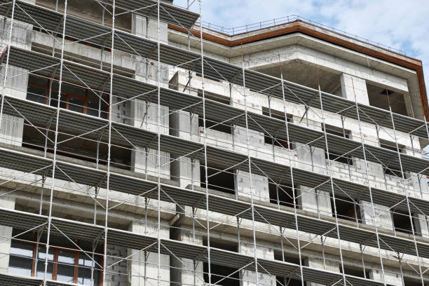 istock new building under construction, scaffolding and concrete 1145177540