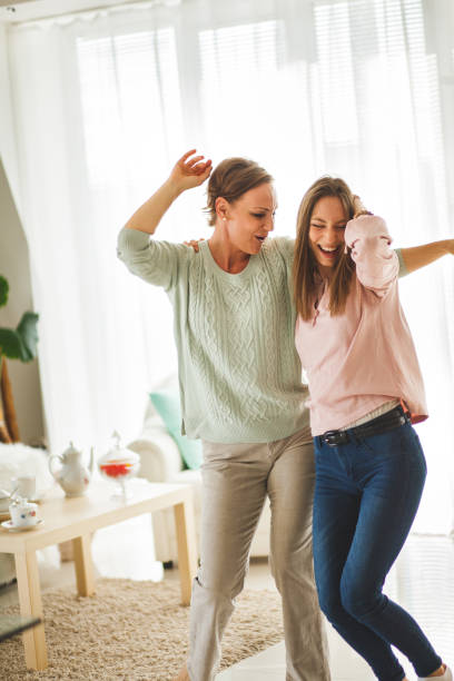 istock Daughter dancing with her mother 1145177731