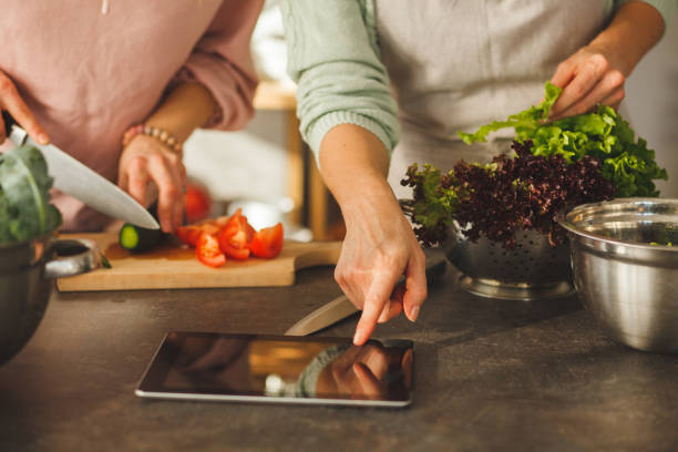 istock Pointing at the recipe on digital tablet 1145178556
