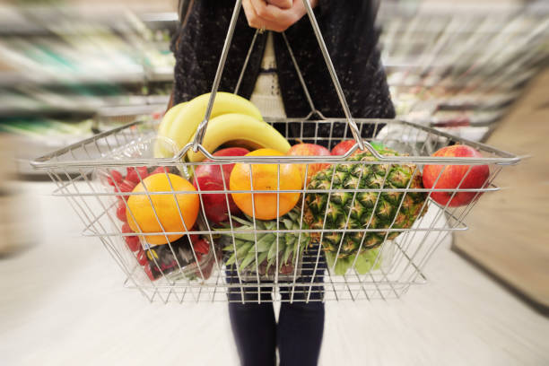 istock Woman buying fruit at supermarket 1145178771