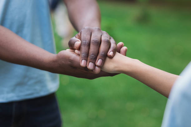 istock Close-up image of supporting hands of friend 1145183136