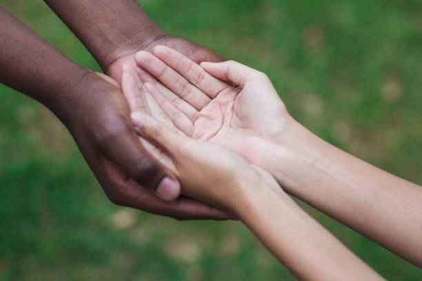istock Man and woman hands held together gesturing they need help 1145183142