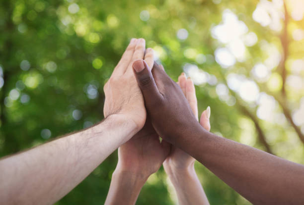 istock Business team giving group high five in park 1145183216