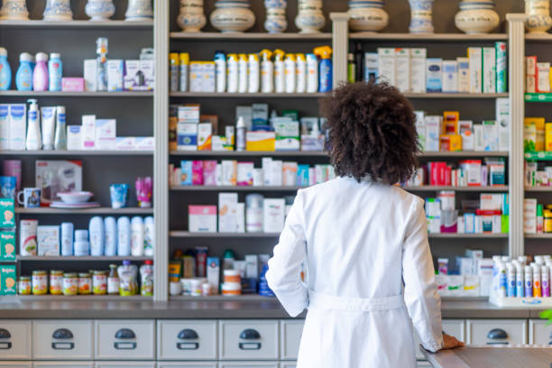 istock Rear view of African american pharmacist 1145186752