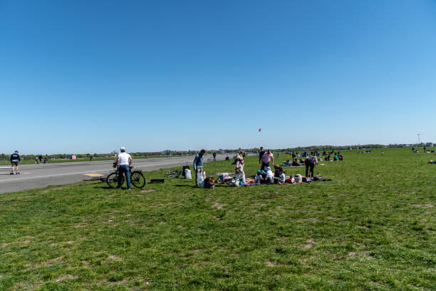 Berlin, Germany - April 22, 2019: Turkish people having a picnic in the park in Tempelhof Field, former airport now a public green area, the largest urban park in Berlin