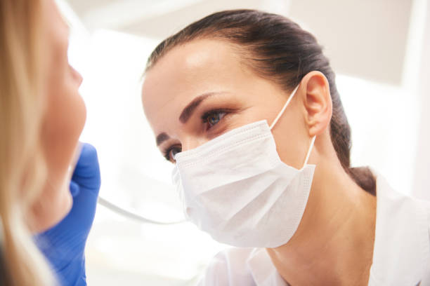 istock Close up of female dentist at work 1145189896