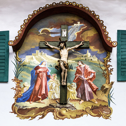 Bavaria, Germany - April 26, 2019: Painting house wall with crucifixion in village Oberammergau, Bavaria, Germany
