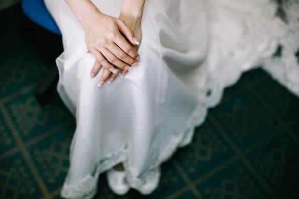 istock Bride dressed in white wedding gown waiting for bridegroom 1145190842