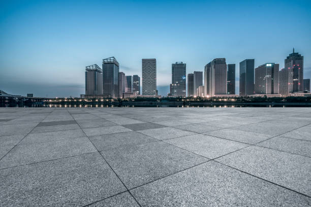 istock night view of empty brick floor front of modern building 1145191000