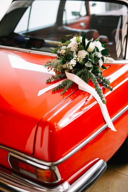 istock Floral wedding decoration on vintage car 1145191156