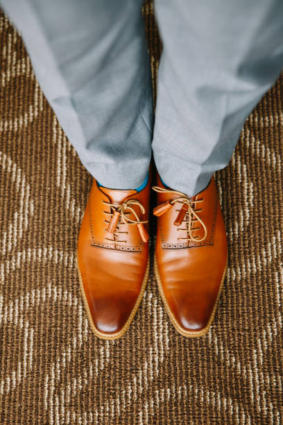 istock Man wearring a brown leather shoe 1145191875