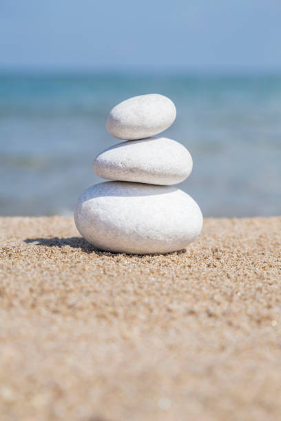 istock stack of pebble stones on balance on sandy beach 1145196096