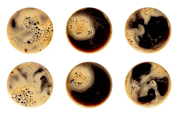 Photo of Coffee foam set isolated on white background. Round top view close up photography of cup