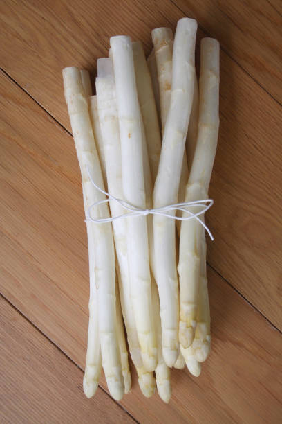 istock Bunch of white asparagus on table 1145198124