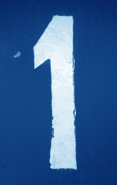 istock Number 1 in stencil on metal wall in navy blue tone. 1145198300