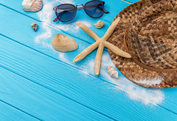 istock Summer travel accessories on blue background 1145199011