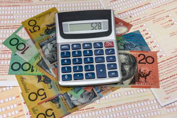 istock Calculator with australian dollars and tax form 1145201182
