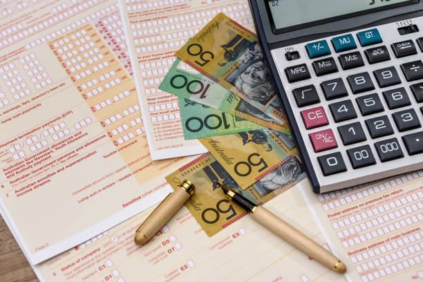 istock Australian tax form with calculator and australian dollars 1145201430