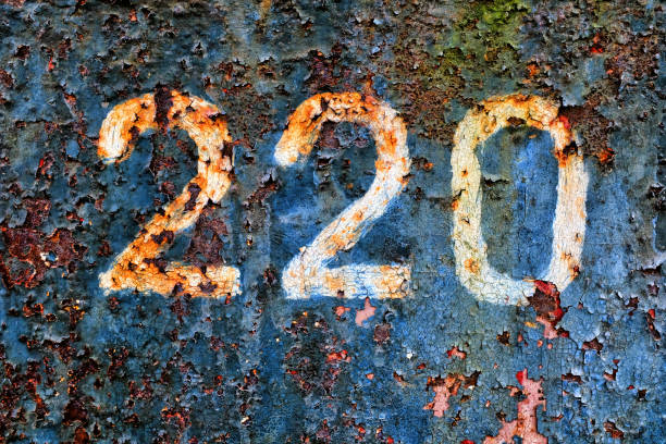 220 on a rusty metal wall. grunge