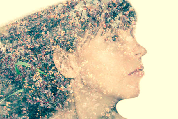 istock Woman in profile. Field spring flowers. Double exposure. 1145204139