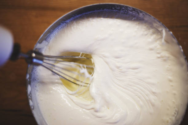 istock cream is whipped with a mixer in a bowl 1145204620