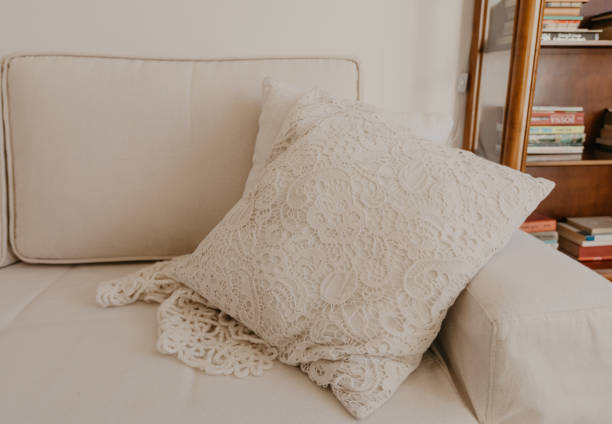 istock beige sofa with pillows in living room - Image 1145205508