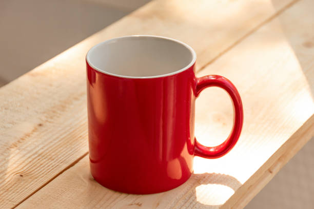 istock Red coffee cup on wooden desk 1145206059