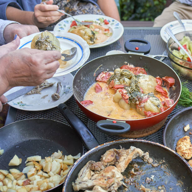 istock Family dinner at a big table outdoors close up 1145206350