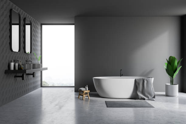 istock Gray bathroom interior, tub and sinks 1145206392