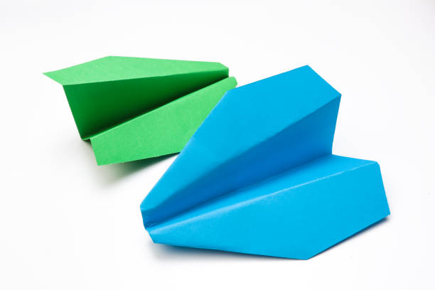 istock Colorful paper plane on white background, Business competition concept - Image 1145206681