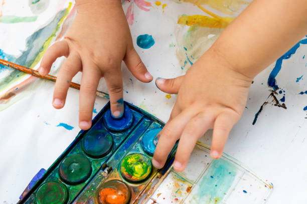 istock Child paint with watercolors. Education concept. 1145207767