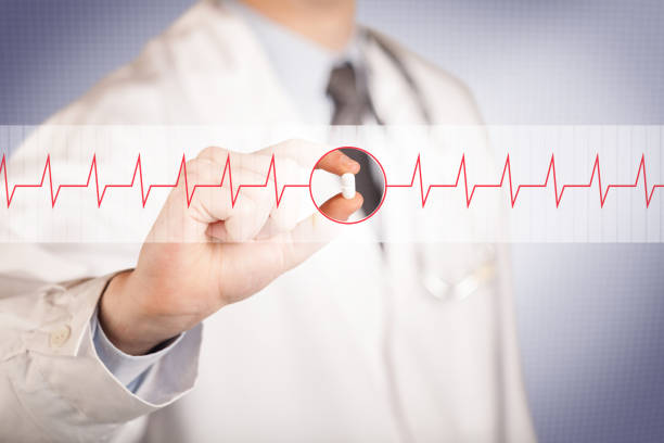 istock A doctor  holding a heart pill 1145208106