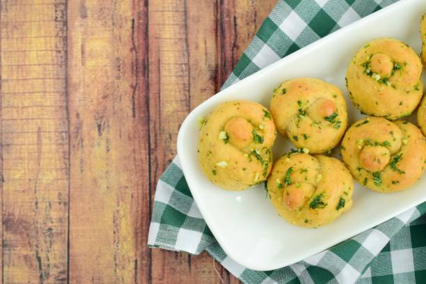 istock Garlic Knot Bread coated with Parsley Garlic Butter Sauce 1145209331