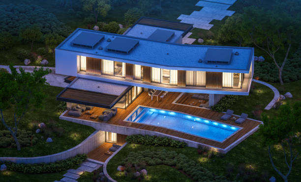 istock 3d rendering of modern house on the hill with pool in night 1145210643