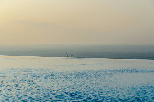 istock Infinity pool with crystal blue water view to sea  ocean 1145211074