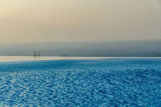 istock Infinity pool with crystal blue water view to sea  ocean 1145211094