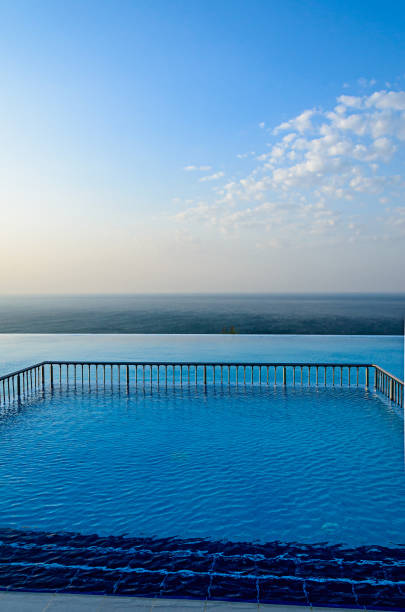 istock Infinity pool with crystal blue water view to sea  ocean 1145211117