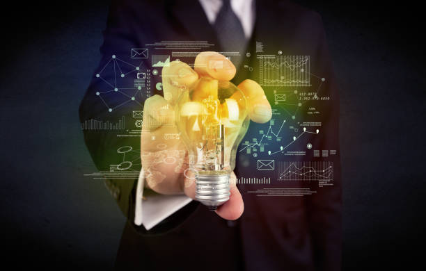 istock businessman holding glowing glass light bulb 1145211446