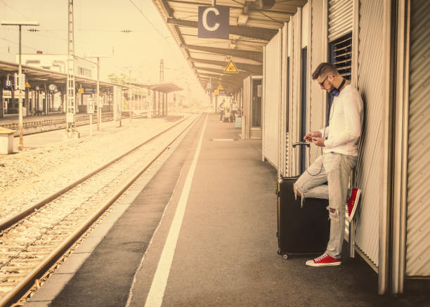 istock stylish hipster man, with a phone in his hand 1145214942