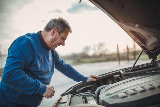 istock person with car breakdown and engine trouble 1145214955