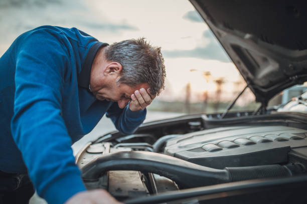 istock person with car breakdown and engine trouble 1145215345