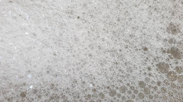 istock Soapy bubbles and reflections on metal plate 1145215586